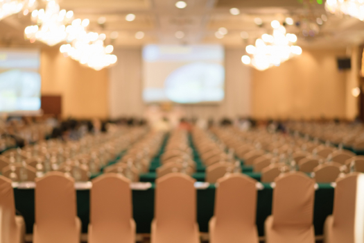 Creds: FreePik - A blurred image of a seminar hall after Tomorrow's Engineers Week announcement