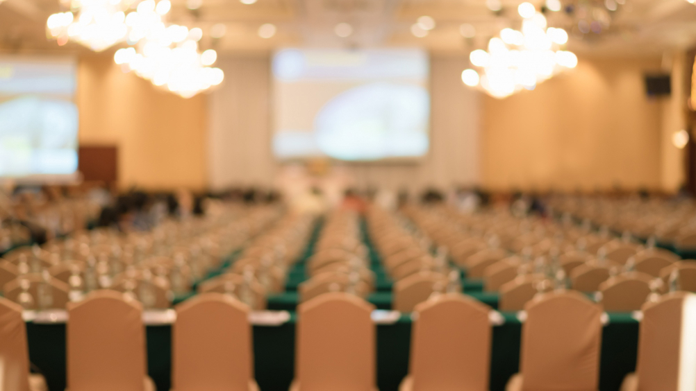 Creds: FreePik - A blurred image of a seminar hall after Tomorrow's Engineers Week announcement
