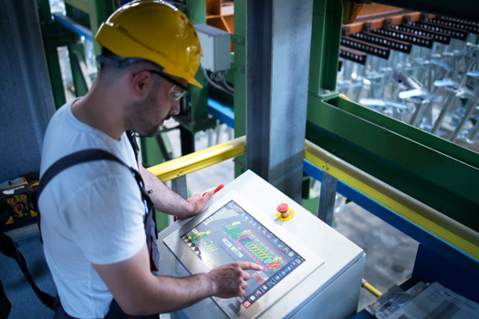 Creds: ABI Research - Man working on a factory plant